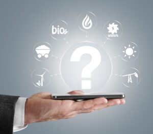 Hand holding a smartphone with icons representing various energy sources, surrounding a question mark.